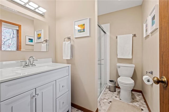 1395 25th St, Houlton, WI 54082 - full bathroom featuring toilet, baseboards, a shower stall, and vanity