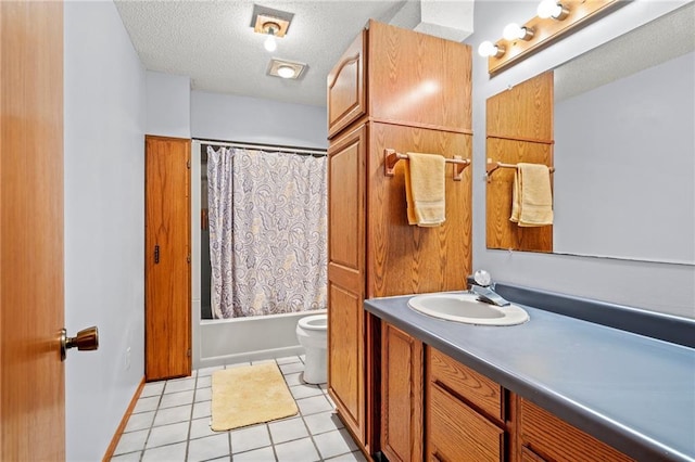 1395 25th St, Houlton, WI 54082 - full bathroom featuring a textured ceiling, toilet, vanity, tile patterned flooring, and shower / bath combo