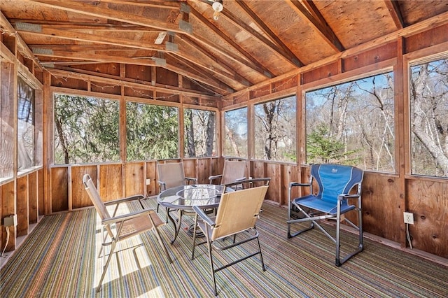 1395 25th St, Houlton, WI 54082 - sunroom featuring lofted ceiling, outdoor dining space, and view of scattered trees