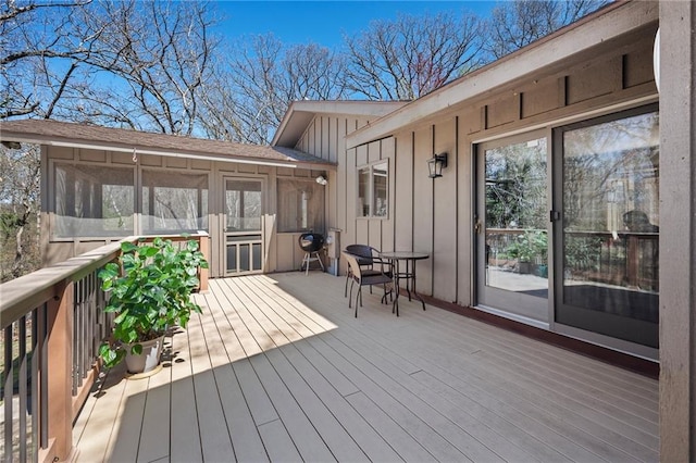 1395 25th St, Houlton, WI 54082 - wooden deck with a sunroom