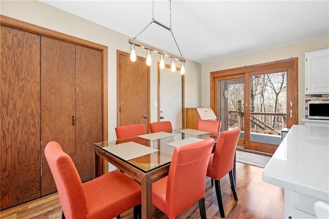 1395 25th St, Houlton, WI 54082 - dining area featuring light wood-style floors