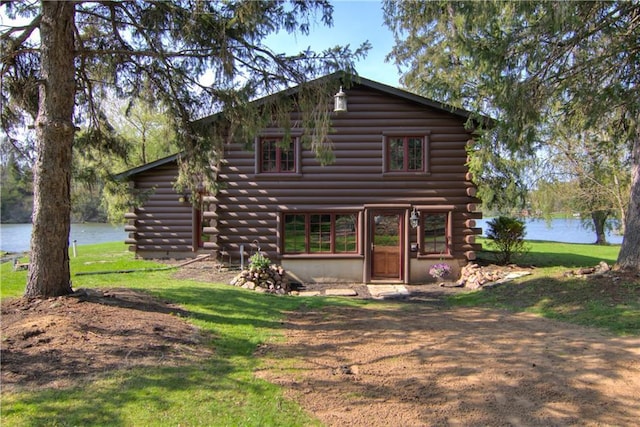 N3858 1000th St, Eau Claire, WI 54703 - rear view of house featuring log exterior, a water view, and a yard