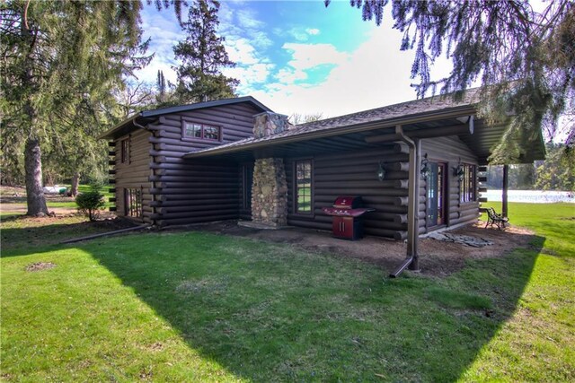 N3858 1000th St, Eau Claire, WI 54703 - view of front facade featuring a front lawn and log exterior