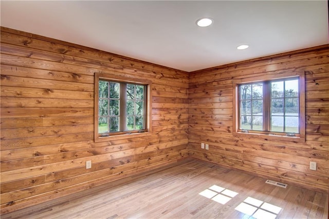 N3858 1000th St, Eau Claire, WI 54703 - unfurnished room with recessed lighting, wood finished floors, and wooden walls