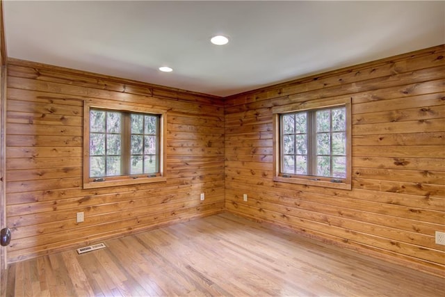 N3858 1000th St, Eau Claire, WI 54703 - unfurnished room with healthy amount of natural light, recessed lighting, light wood-type flooring, and wooden walls