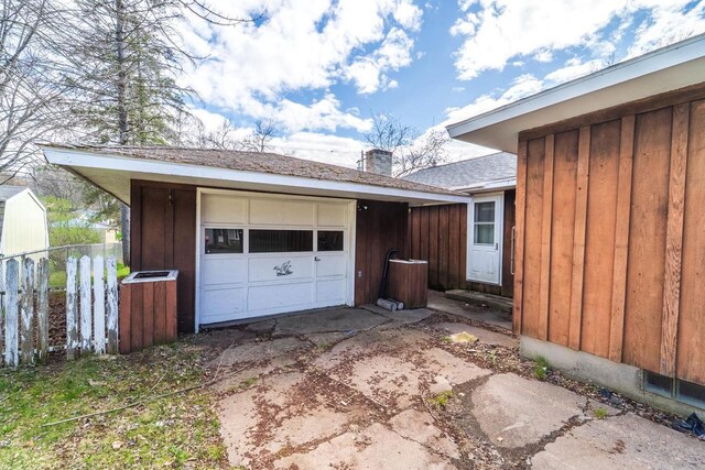 1233 Plumer St, Wausau, WI 54403 - garage with concrete driveway and fence