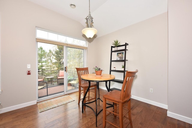 18235 W Wisconsin Ave, Brookfield, WI 53045 - dining space featuring vaulted ceiling, baseboards, and wood finished floors