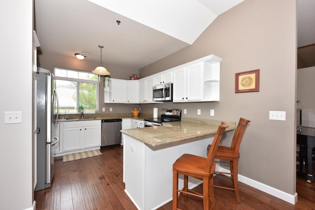 18235 W Wisconsin Ave, Brookfield, WI 53045 - kitchen with stainless steel appliances, a peninsula, open shelves, a sink, and dark wood finished floors