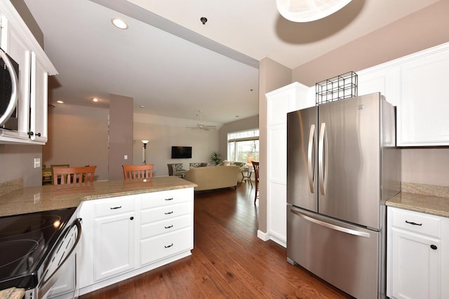 18235 W Wisconsin Ave, Brookfield, WI 53045 - kitchen featuring appliances with stainless steel finishes, white cabinets, dark wood-style floors, a peninsula, and open floor plan