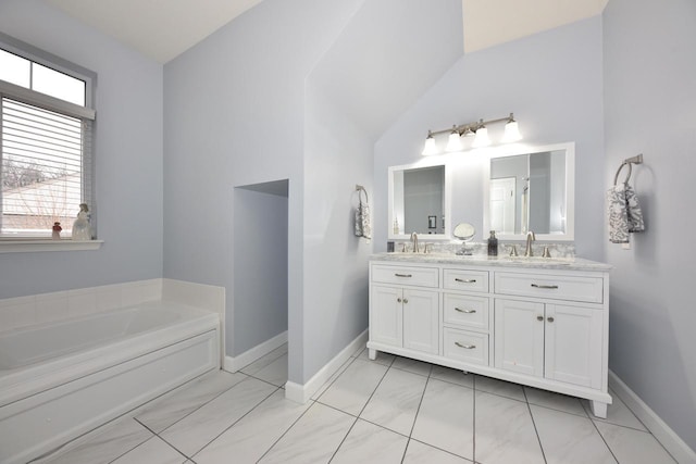 18235 W Wisconsin Ave, Brookfield, WI 53045 - full bath with vaulted ceiling, baseboards, double vanity, and a bath