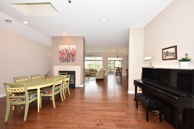 18235 W Wisconsin Ave, Brookfield, WI 53045 - dining room featuring wood finished floors, a fireplace, baseboards, and recessed lighting