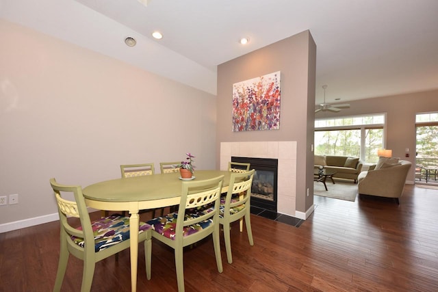 18235 W Wisconsin Ave, Brookfield, WI 53045 - dining space with a tiled fireplace, dark wood-type flooring, baseboards, recessed lighting, and a ceiling fan