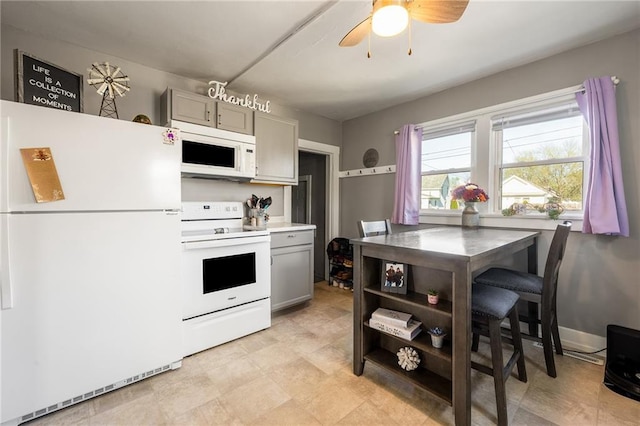 719 Huebsch Blvd, Eau Claire, WI 54701 - kitchen featuring white appliances, gray cabinets, a ceiling fan, and light countertops