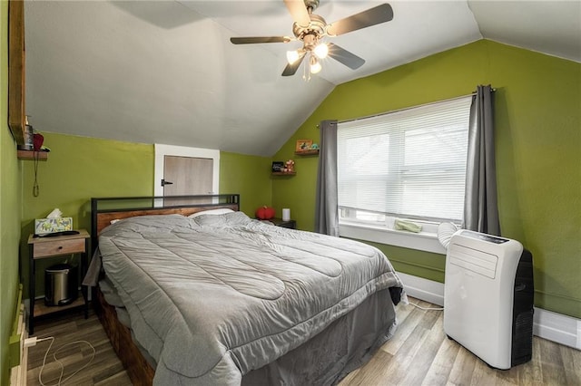 719 Huebsch Blvd, Eau Claire, WI 54701 - bedroom with vaulted ceiling, wood finished floors, ceiling fan, and baseboards