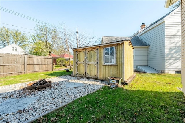 719 Huebsch Blvd, Eau Claire, WI 54701 - view of shed with an outdoor fire pit