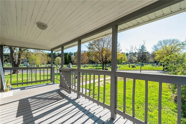 719 Huebsch Blvd, Eau Claire, WI 54701 - wooden terrace with a lawn and view of scattered trees