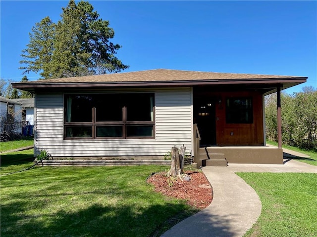 318 Spruce St, Spooner, WI 54801 - view of front of house with a front yard