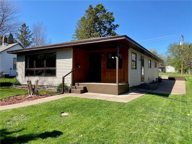 318 Spruce St, Spooner, WI 54801 - single story home featuring a front lawn and central air condition unit