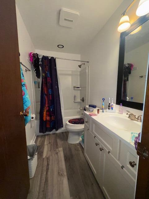 10547 W Wabash Ave Unit 10549, Milwaukee, WI 53224 - bathroom with shower / bath combination with curtain, vanity, wood finished floors, and toilet