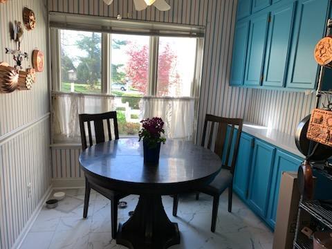 4 Red Cedar Trl, Madison, WI 53717 - dining room featuring light marble finish floors, wallpapered walls, and ceiling fan