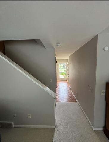 4 Red Cedar Trl, Madison, WI 53717 - hallway featuring baseboards, light carpet, and stairway
