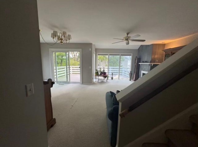 4 Red Cedar Trl, Madison, WI 53717 - stairway with carpet, a ceiling fan, and a chandelier