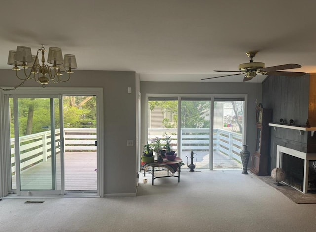 4 Red Cedar Trl, Madison, WI 53717 - living area featuring carpet flooring, a large fireplace, a chandelier, a ceiling fan, and baseboards