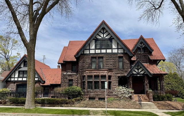 2701 N Lake Dr, Milwaukee, WI 53211 - tudor home with stone siding and fence