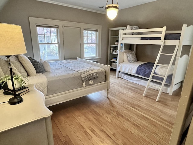 2701 N Lake Dr, Milwaukee, WI 53211 - bedroom featuring wood finished floors and crown molding