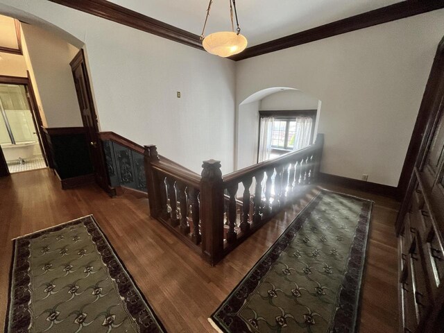 2701 N Lake Dr, Milwaukee, WI 53211 - stairway with arched walkways, crown molding, and wood finished floors