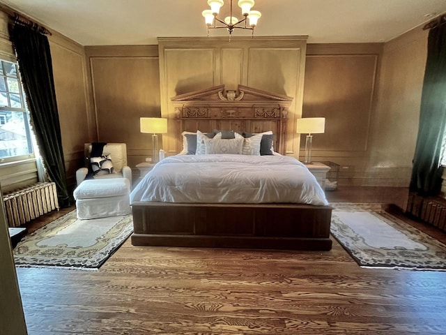 2701 N Lake Dr, Milwaukee, WI 53211 - bedroom featuring radiator heating unit and wood finished floors