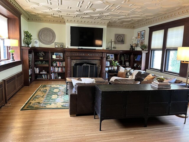 2701 N Lake Dr, Milwaukee, WI 53211 - living area featuring an ornate ceiling, a fireplace, and light wood-style floors