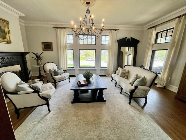 2701 N Lake Dr, Milwaukee, WI 53211 - living area with a chandelier, healthy amount of natural light, crown molding, wood finished floors, and baseboards