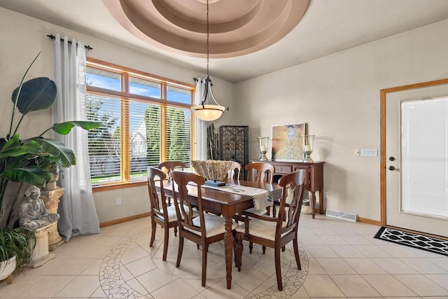 dining area featuring baseboards and light tile patterned flooring