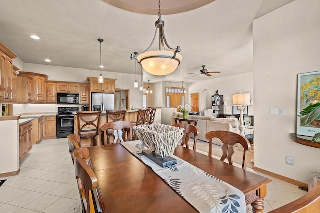 dining space with light tile patterned flooring, ceiling fan, recessed lighting, and baseboards