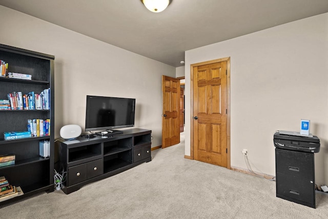 sitting room with carpet flooring and baseboards