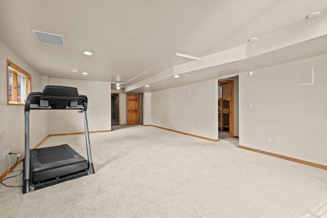 workout area featuring baseboards, recessed lighting, and light carpet