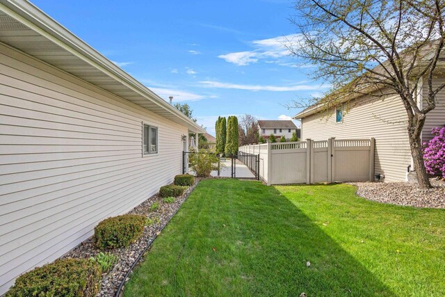 view of yard with a gate