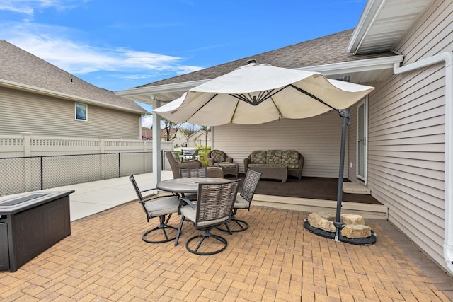 view of patio / terrace featuring fence, outdoor lounge area, and outdoor dining space