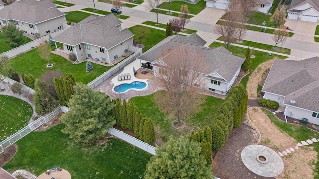 aerial view of property's location with nearby suburban area and a pool