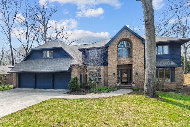 3311 S Scarlet Oak Ln, Appleton, WI 54915 - view of front of property featuring brick siding, concrete driveway, a front yard, and a shingled roof