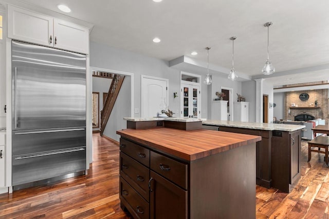3311 S Scarlet Oak Ln, Appleton, WI 54915 - kitchen with wood counters, stainless steel built in fridge, a kitchen island, dark wood-type flooring, and dark brown cabinets