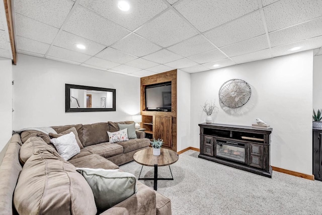 living area with carpet, baseboards, a paneled ceiling, and recessed lighting