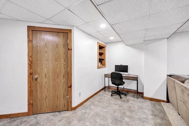 home office with baseboards, a paneled ceiling, and recessed lighting