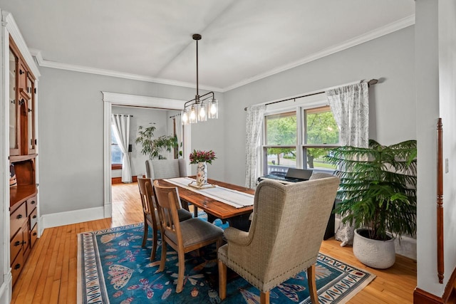 1753 Oneida Ct, Grafton, WI 53024 - dining space featuring light wood finished floors, ornamental molding, and baseboards