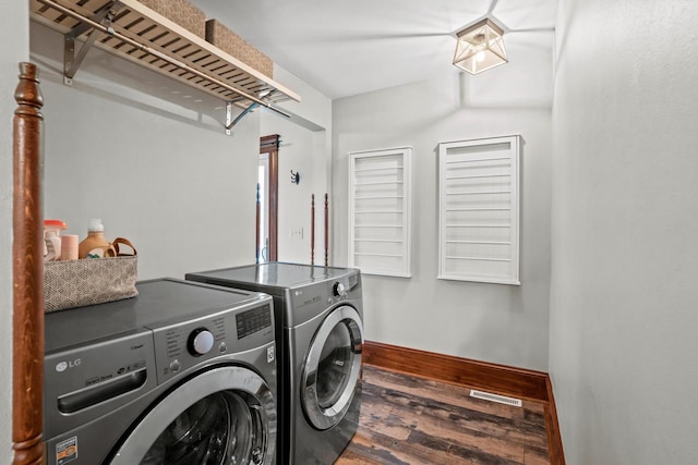 1753 Oneida Ct, Grafton, WI 53024 - laundry area with washing machine and clothes dryer, wood finished floors, and baseboards