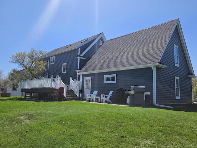 1753 Oneida Ct, Grafton, WI 53024 - back of property featuring a wooden deck, a yard, and a shingled roof