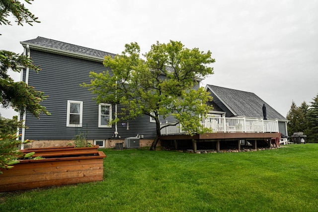 1753 Oneida Ct, Grafton, WI 53024 - back of property featuring a deck, central air condition unit, and a yard