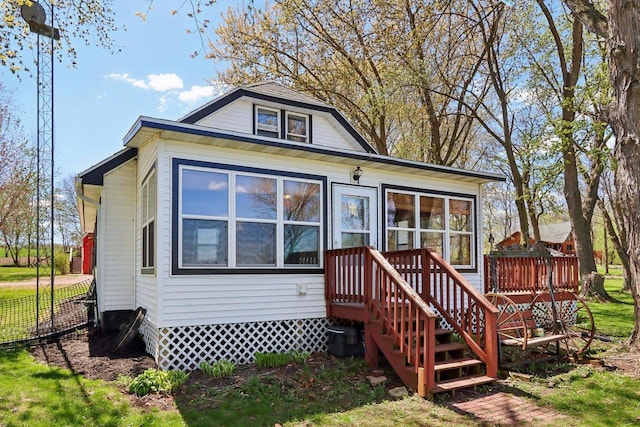 4121 1st Ave, Briggsville, WI 53920 - back of house featuring a wooden deck and fence