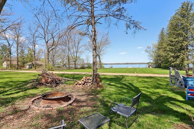 4121 1st Ave, Briggsville, WI 53920 - view of green lawn with a fire pit and a water view